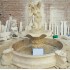 FONTANA CENTRALE IN TRAVERTINO CON CORNUCOPIE
